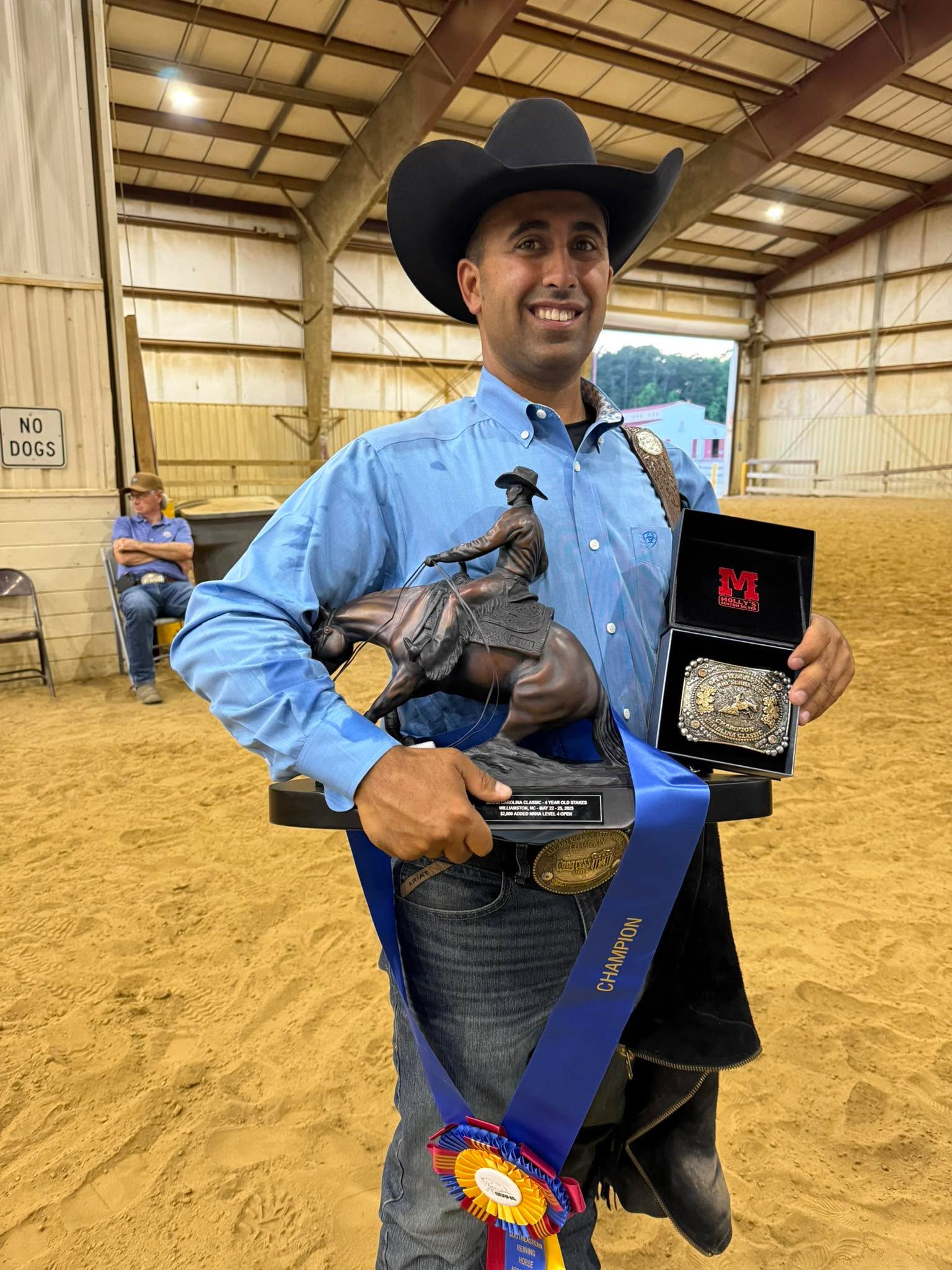 Vincienzo Santos holding trophies at the 2025 SERHA Carolina Classic